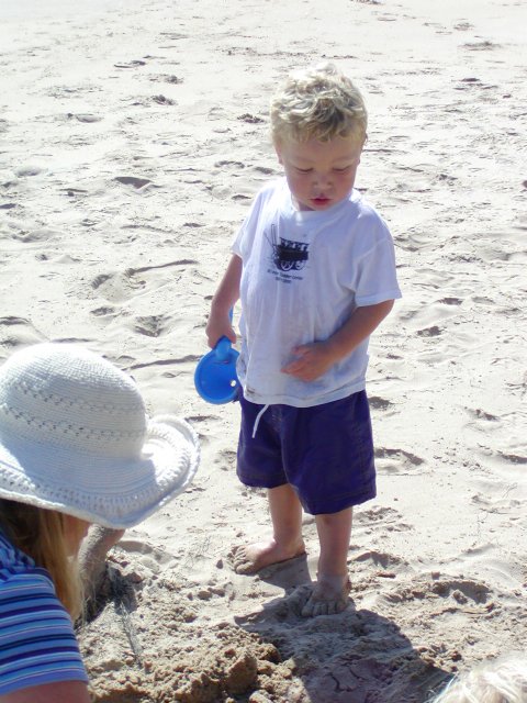 Timothy and Diana dig in the sand