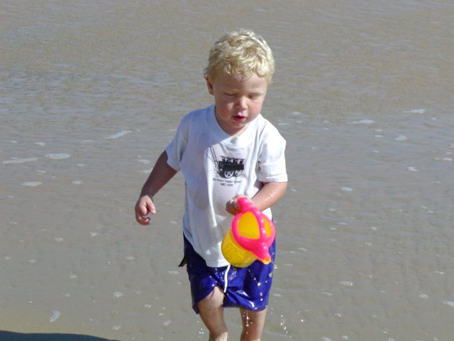 Timothy pours water into the sea