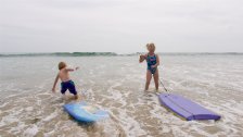 Sara and Timothy with body boards