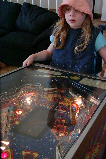 Charlotte playing pinball, I