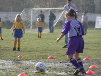 Natalie about to kick a mudball
