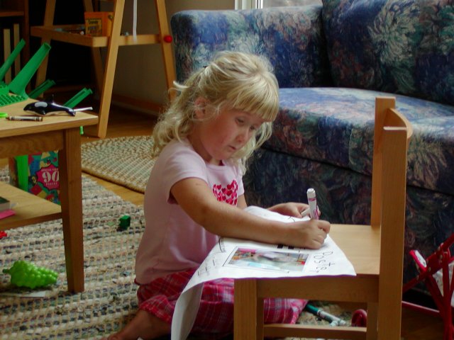 Sara making a poster