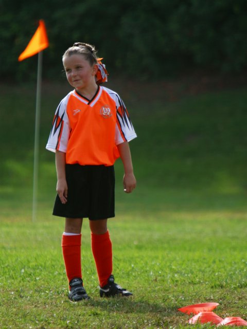 Orange uniform, orange flag, orange cones