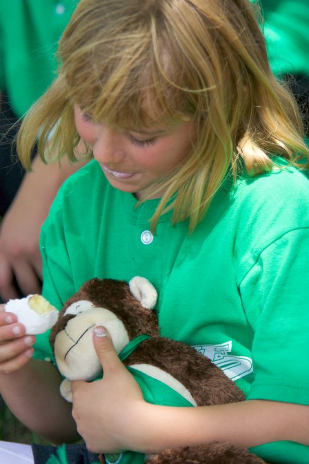 Jennifer shares her snack with the player-of-the-game monkey