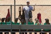 Coach John gives a pre-game pep talk