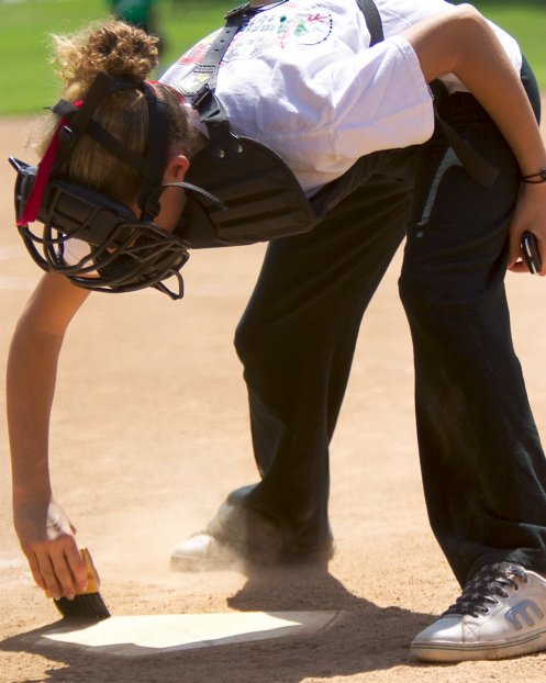 The ump cleans the plate