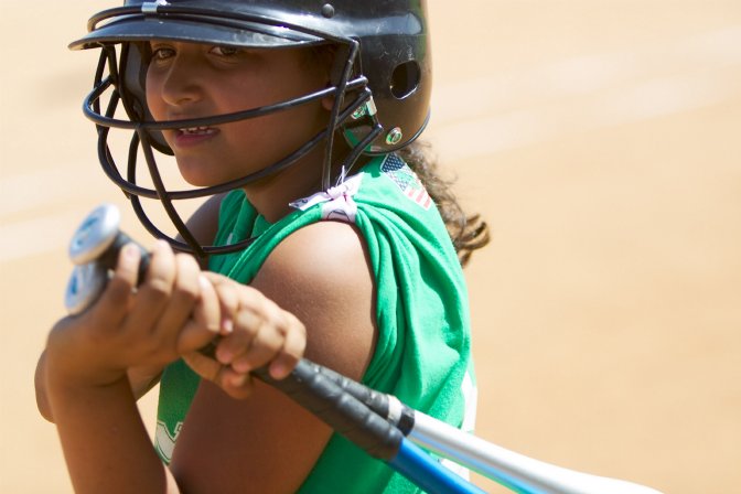 Ashley warming up with two bats