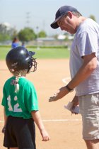 Sara gets some coaching before her at-bat