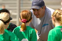 Coach Todd huddles with the players