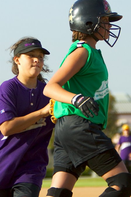 Breanna tagged out, halfway up the first base line