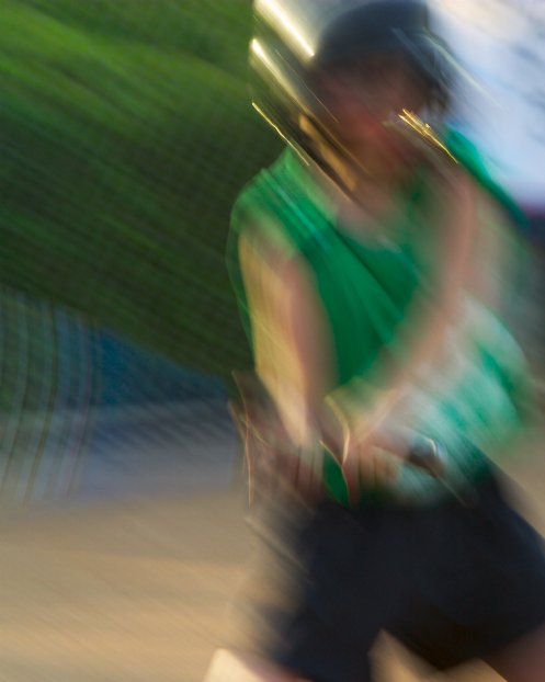 Megan at bat, motion-blurred