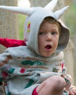 Timothy as a triceratops in a tree