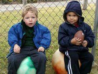 Tim and Nate sit on the big balls