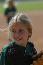 Sophie taking off her catcher's equipment