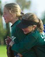 Lindsay hugs her twin at the end of the inning