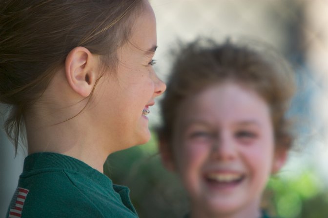 Elaine and Haley share a laugh in the dugout
