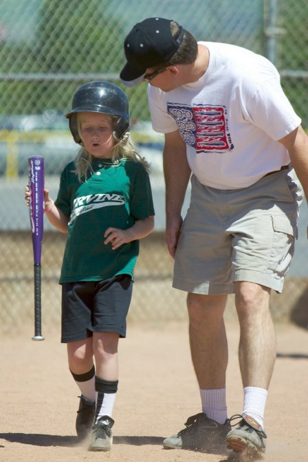 Coach Dave comforts Sara after her strikeout