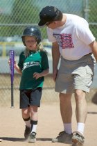 Coach Dave comforts Sara after her strikeout