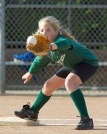 Nicole warming up at first base