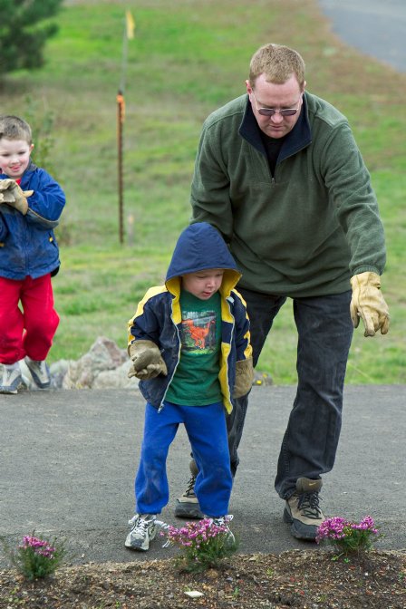 Simon shows Timothy where to toss the stones