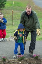 Simon shows Timothy where to toss the stones