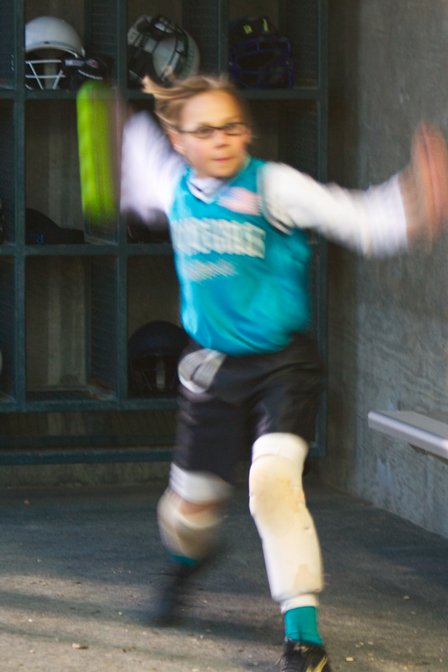 Taylor pretending to pitch in the dugout