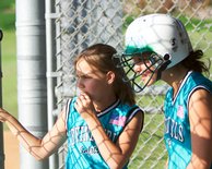 Taylor and Shannon watch from the dugout