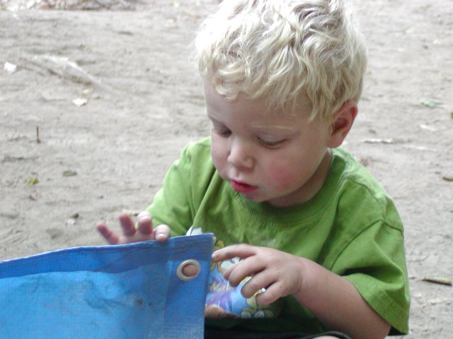 Timothy plays with the tent