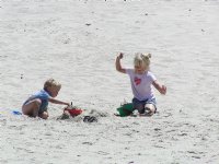 Timothy and Sara play with sand toys