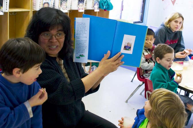 Helen shows off Timothy's birthday gift to the center