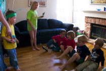 Sara tells the boys how to play bug-bug-spider