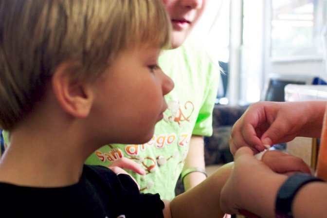 Casey admires his new tattoo