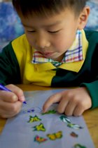 Daniel decorates his bug bag