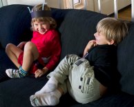 Nico and Casey play tag in the living room