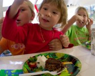 Nico eats a gummy worm from his cake