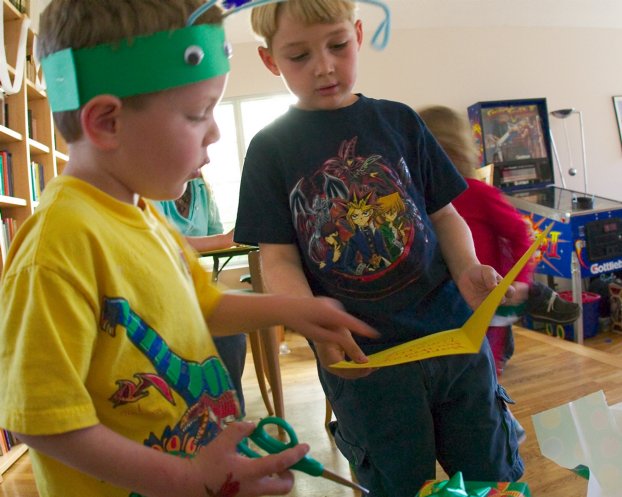 Sam helps Timothy read his card