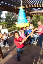 Tayo swings at the pinata