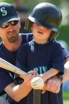 Timothy gets some help with his swing