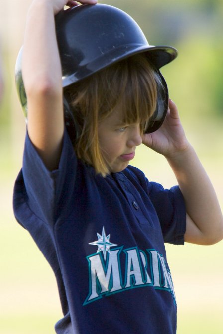 Alana adjusts her helmet