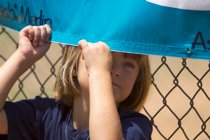 Alana plays behind the Mariner banner