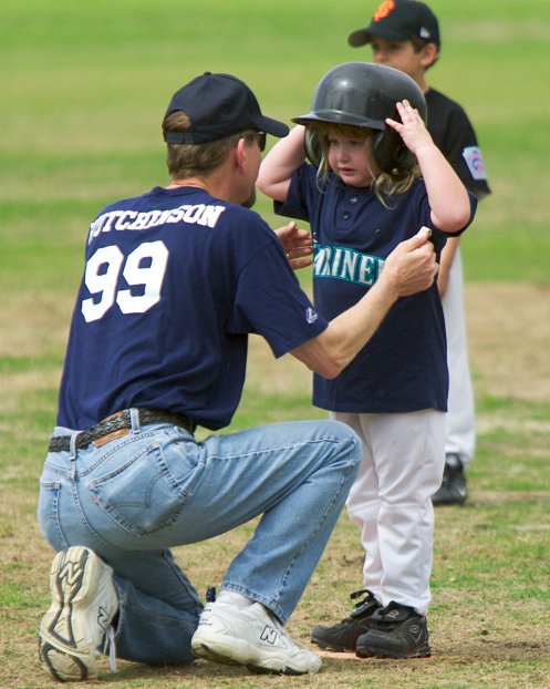 Michela gets comforted after running into a Giant at second base