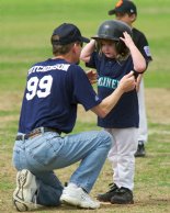 Michela gets comforted after running into a Giant at second base