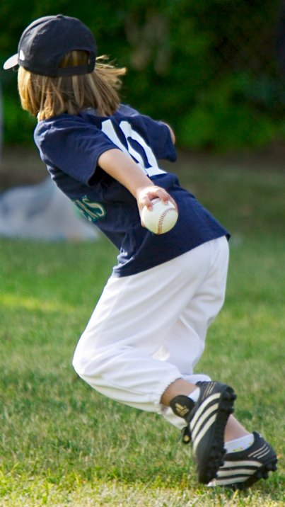 Alana running to first with the ball