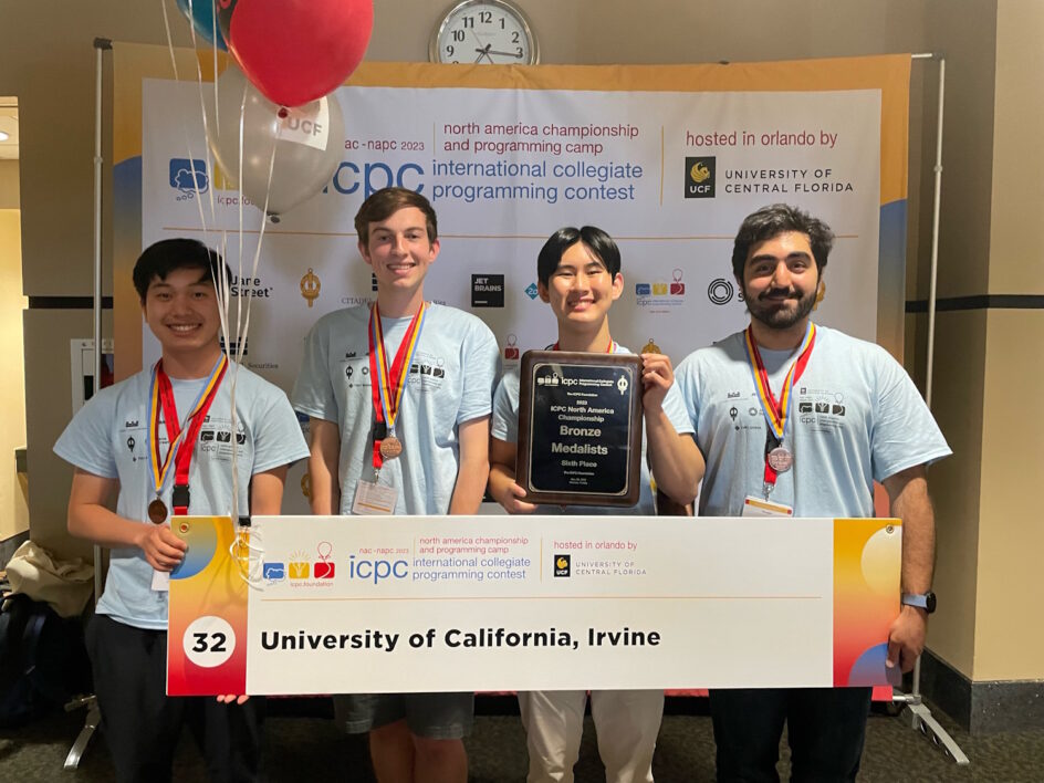 Team UCI Map: Jerry Li, Thomas Neill, and Elijah Huang with computer science Ph.D. student Pooya Khosravi, one of their coaches.