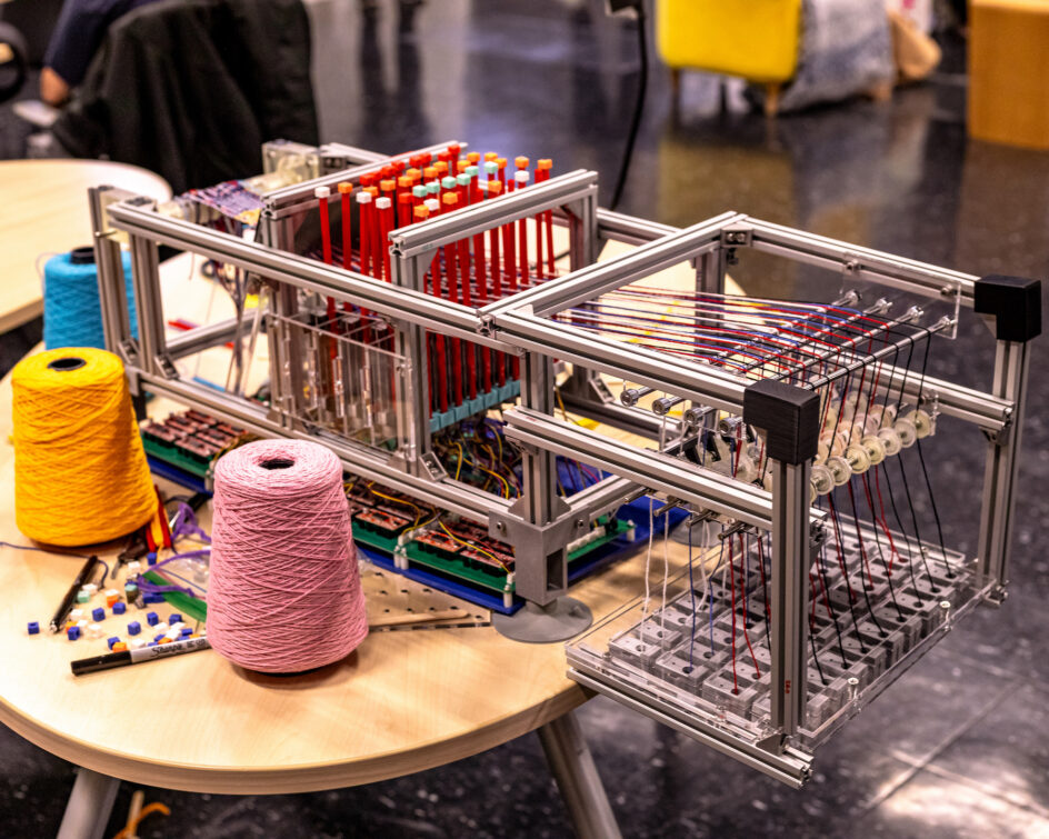 A robotic loom with thread.