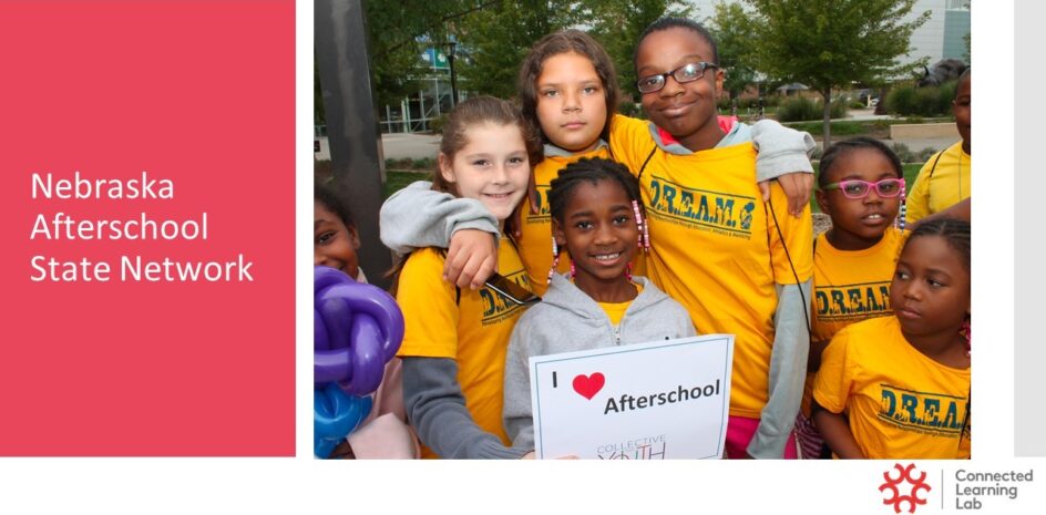 : A group of students standing together, with one holding a sign that says “I love afterschool.”