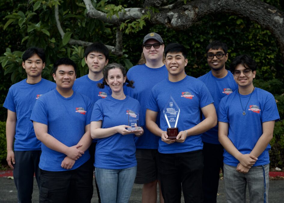 Group photo of everyone in their CCDC shirts, holding their award.