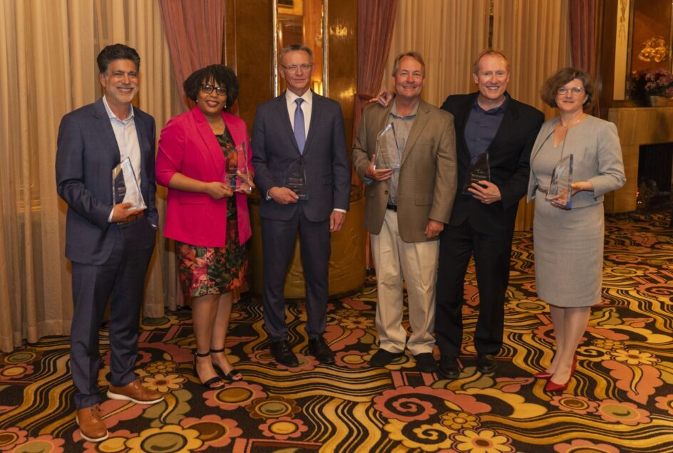 The six inductees standing together inside the ship