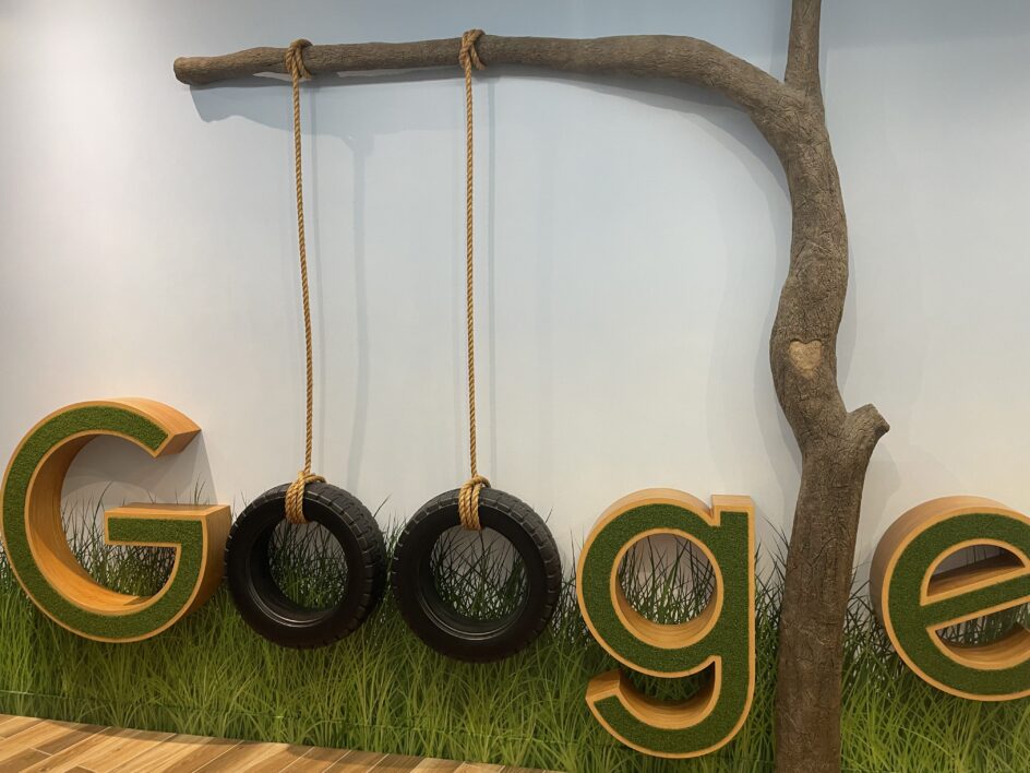 Creative Google logo with two tires hanging on branch for the letter o.