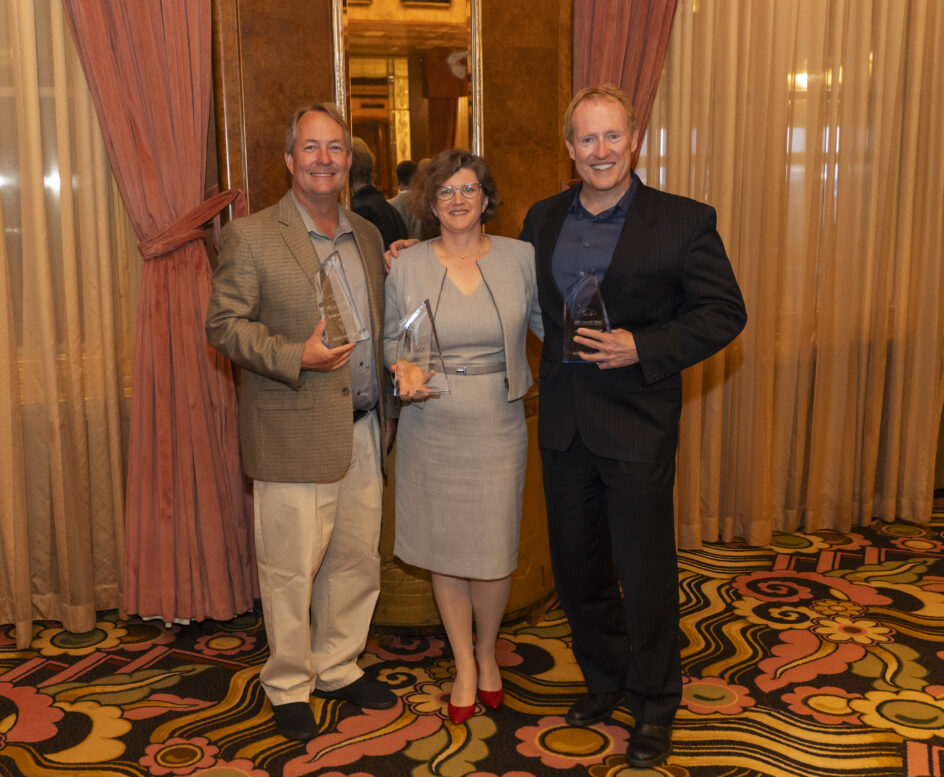 The three ICS alumni in the Queen Mary, holding their awards.